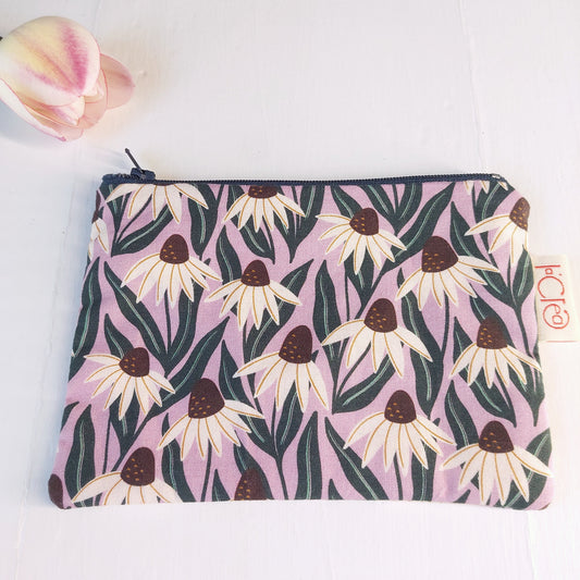 Pochette in cotone viola, bianco e verde con decorazione floreale, foderata.